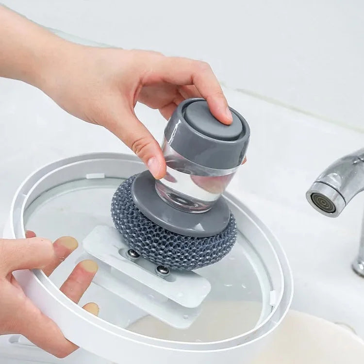 Using the palm scrubber on a kitchen cookware lid