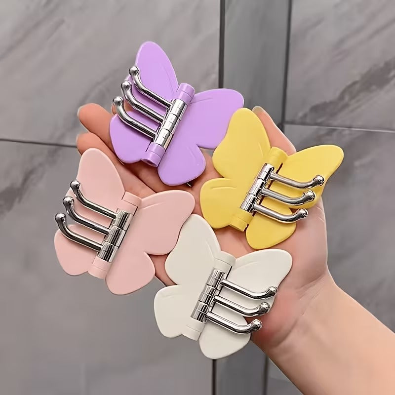 Wall mounted butterfly hooks in pastel colours featuring three metal hanging hooks